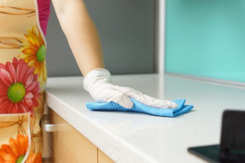 Technician preparing carpet cleaning equipment in an East Ham property