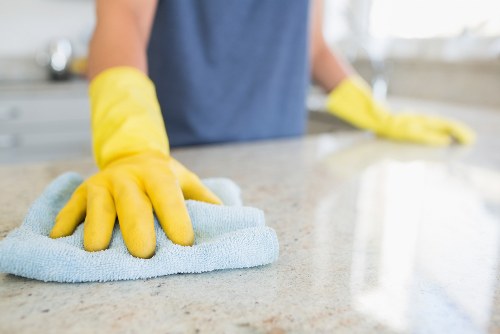 Cleaning staff using safe methods and protective equipment